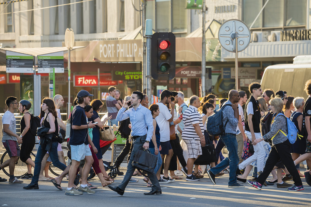 [Australia] Workers back-paid $473 million through FWO recovery - workers and commuters at busy Melbourne crosswalk, FWO recovers record backpay Australia