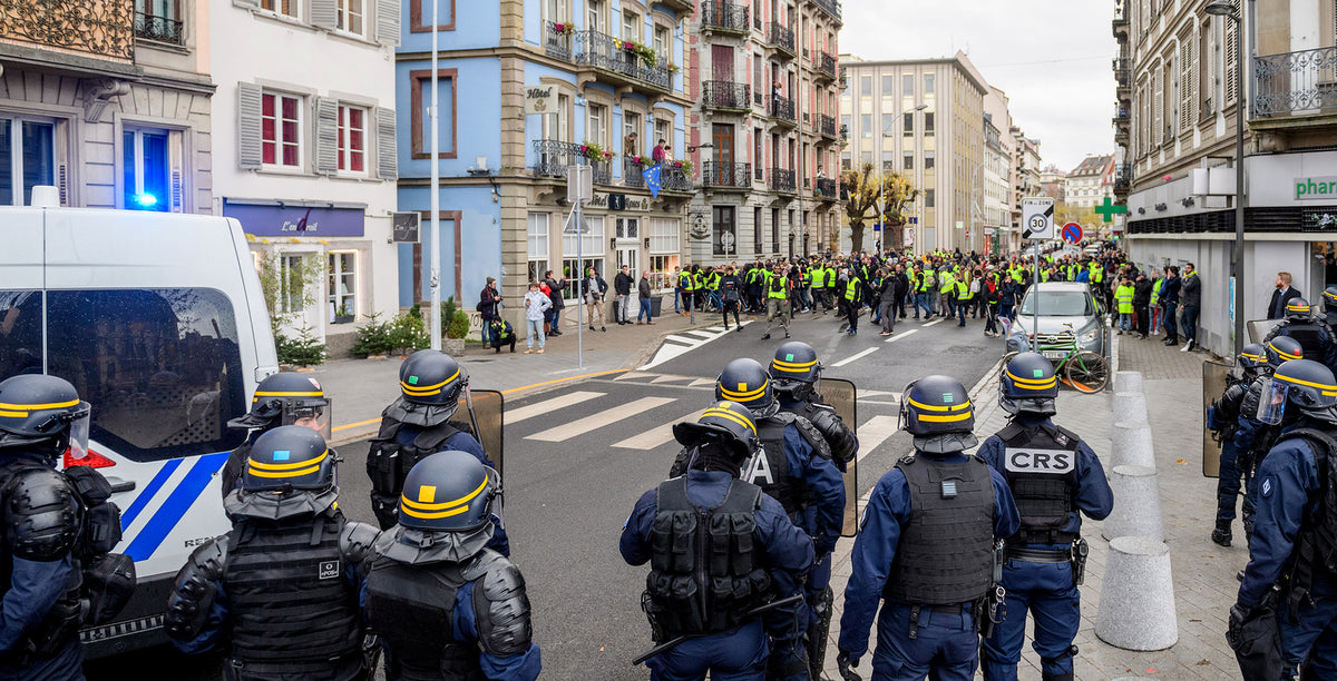 President Macron promises French protestors to up minimum wage